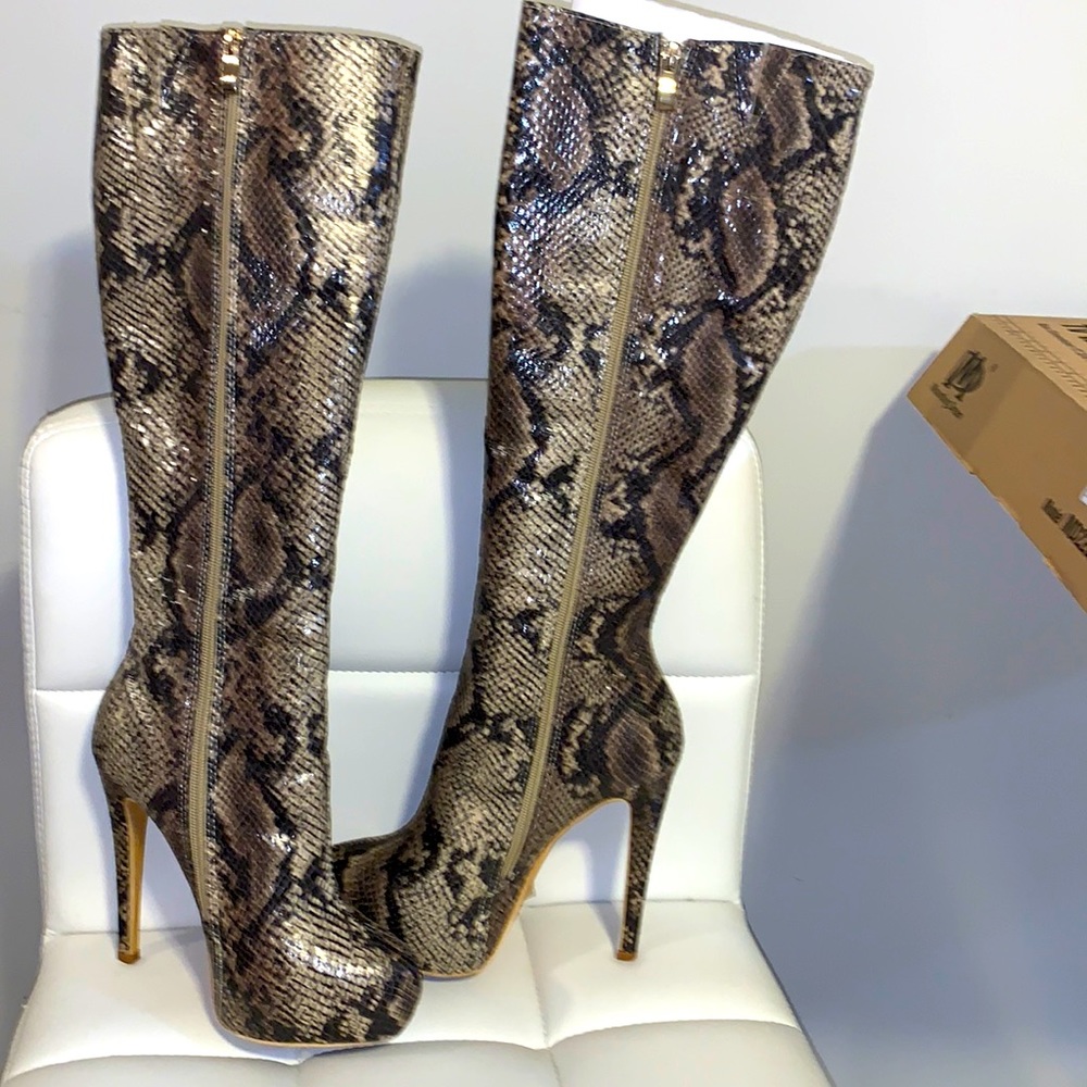 Snake skin knee high boots with stack in front for easy sexy walking